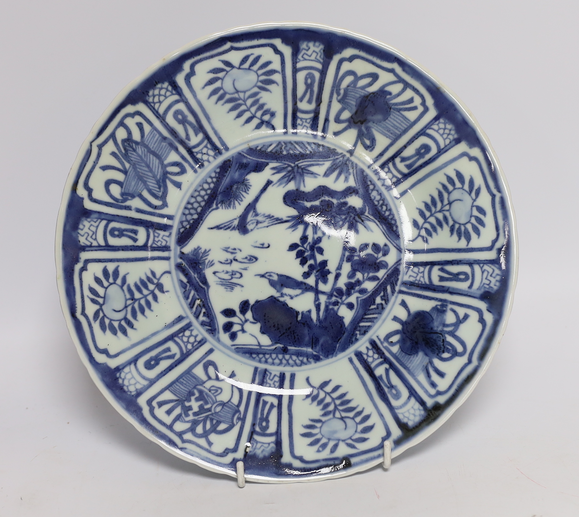 Two Chinese blue and white plates and a similar shallow bowl, largest 26cm high